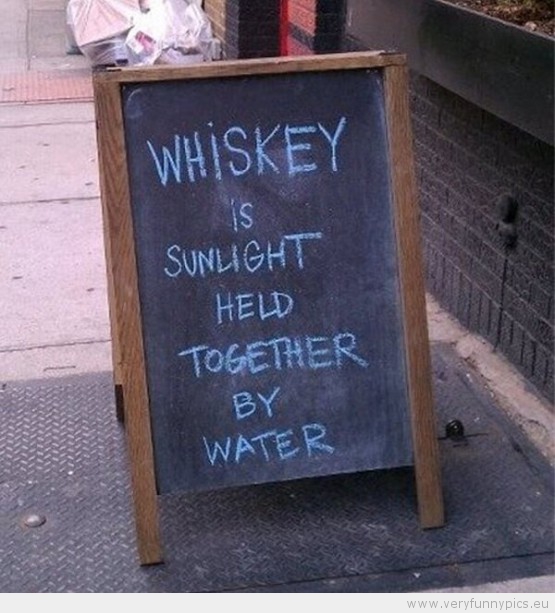 Funny Picuture - Whiskey is sunlight held together by water sign