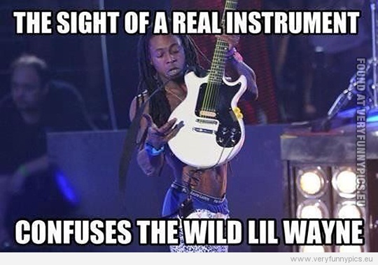 Funny Picture - The sight of a real instrument confuses the wild Lil Wayne