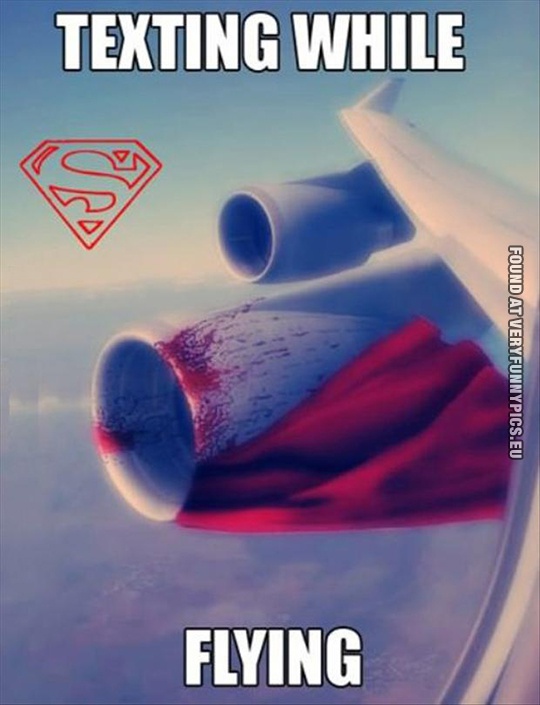 Funny Picture - Texting while flying - Superman in airplane engine