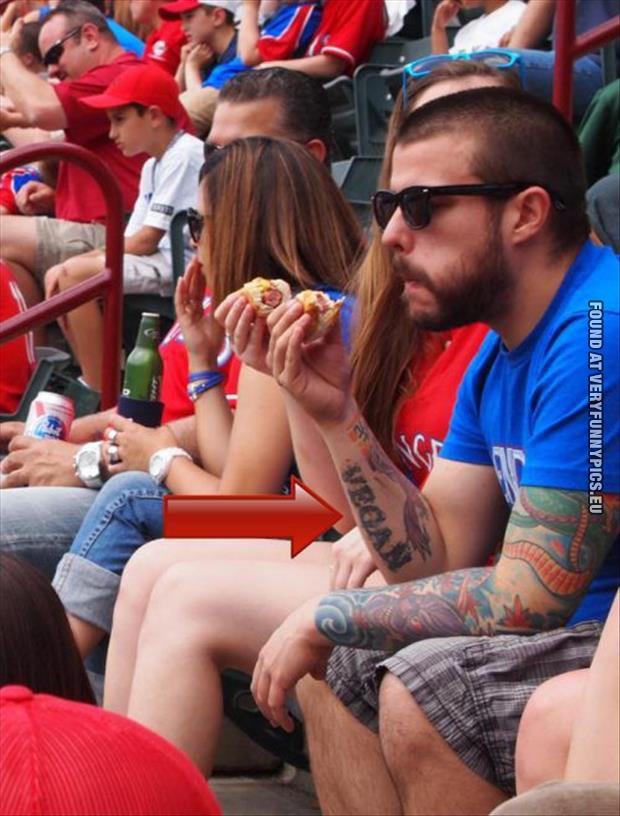 funny picture vegan eating hot dog