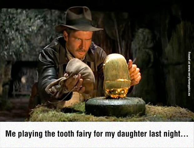 funny-pictures-indy-playing-the-tooth-fairy