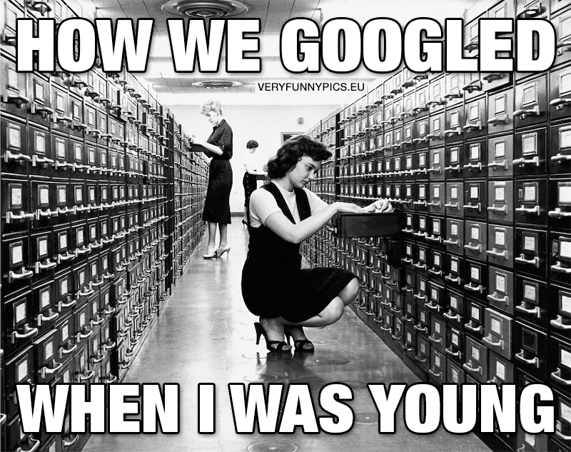 Woman searching information using a card index - How we Googled when i was young
