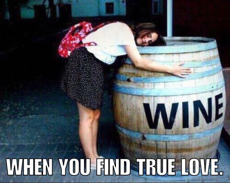 Woman leaning on a barrel of wine - When you find true love